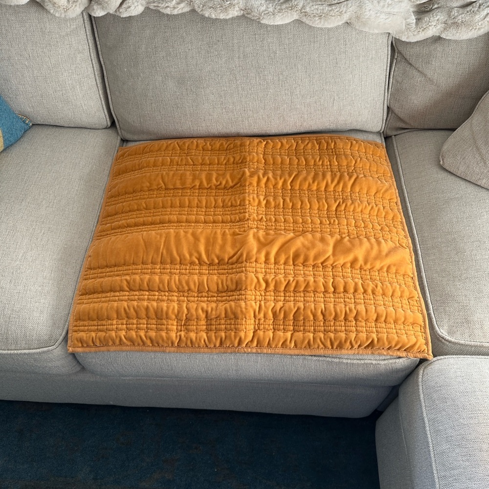 Threshold Lofty Velvet quilted sham in a golden orange color.